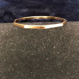 Gold tone bangle